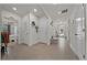 Inviting hallway features tile flooring, neutral walls, and views of the exterior through a glass door at 96 Hickory Crse, Ocala, FL 34472