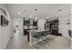Kitchen island with breakfast bar, granite countertops, stainless steel appliances and dark cabinets at 96 Hickory Crse, Ocala, FL 34472