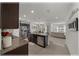 Open-concept kitchen featuring a large island and stainless steel appliances at 96 Hickory Crse, Ocala, FL 34472