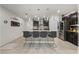 Kitchen island with breakfast bar, granite countertops, stainless steel appliances and dark cabinets at 96 Hickory Crse, Ocala, FL 34472