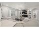 Bright living room features a fireplace, large television, and comfortable seating area at 96 Hickory Crse, Ocala, FL 34472