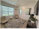 Modern living room with plush rug, comfortable seating, and bright natural light from the window at 96 Hickory Crse, Ocala, FL 34472