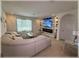 Cozy living room with a modern fireplace, decorative stone wall, and stylish furnishings at 96 Hickory Crse, Ocala, FL 34472