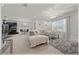 Open-concept living room with grey sofa, large window and open access to the kitchen at 96 Hickory Crse, Ocala, FL 34472