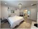 Bright main bedroom features decorative light fixture and white decor at 96 Hickory Crse, Ocala, FL 34472