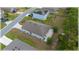 Back exterior view showing the house with a patio and green lawn at 96 Hickory Crse, Ocala, FL 34472