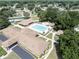 Aerial view of the community pool, tennis court, and clubhouse amenities at 10523 Sw 62Nd Terrace Rd, Ocala, FL 34476