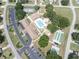 Aerial shot showcasing the community's amenities, including the pool, courts, and parking areas at 10523 Sw 62Nd Terrace Rd, Ocala, FL 34476