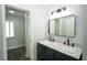 Bathroom features a double sink vanity with marble countertop and modern black fixtures at 10523 Sw 62Nd Terrace Rd, Ocala, FL 34476