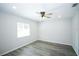 This airy bedroom offers a ceiling fan, recessed lighting, and wood-look flooring at 10523 Sw 62Nd Terrace Rd, Ocala, FL 34476