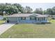 Charming single-story home features a manicured lawn and a two car garage at 10523 Sw 62Nd Terrace Rd, Ocala, FL 34476