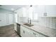 Bright and updated kitchen featuring granite countertops and stainless steel appliances at 10523 Sw 62Nd Terrace Rd, Ocala, FL 34476