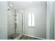 Newly renovated shower featuring subway tile and a shower rack for storage and organization at 10523 Sw 62Nd Terrace Rd, Ocala, FL 34476