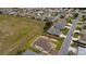 Aerial view emphasizing a property's landscaping, highlighted with red lines to clearly define its boundaries at 11871 Se 91St Cir, Summerfield, FL 34491