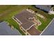 Bird's eye view of a single-Gathering home featuring lush landscaping, a well-kept lawn, and an attractive driveway at 11871 Se 91St Cir, Summerfield, FL 34491