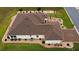 Aerial view of home featuring a well-maintained roof, landscaping, and a decorative driveway at 11871 Se 91St Cir, Summerfield, FL 34491