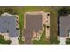 Top down aerial view of a single Gathering home with manicured lawn and landscaping at 11871 Se 91St Cir, Summerfield, FL 34491