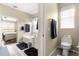 This split bathroom features a soaking tub with shower, a toilet, and a neutral color palette at 11871 Se 91St Cir, Summerfield, FL 34491