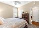 Cozy bedroom featuring a window with blinds and a dresser with drawers at 11871 Se 91St Cir, Summerfield, FL 34491