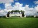 Welcoming entrance to Spruce Creek Country Club with signage and well-maintained landscaping at 11871 Se 91St Cir, Summerfield, FL 34491