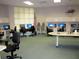 Brightly lit computer room with multiple workstations and comfortable seating at 11871 Se 91St Cir, Summerfield, FL 34491