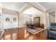 Dining room with hardwood floors, wainscoting, plantation shutters, and elegant chandelier at 11871 Se 91St Cir, Summerfield, FL 34491