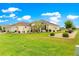 Well-maintained exterior featuring lush landscaping and manicured lawn at 11871 Se 91St Cir, Summerfield, FL 34491
