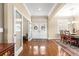 Inviting foyer with gleaming hardwood floors, decorative double doors, and elegant trim work at 11871 Se 91St Cir, Summerfield, FL 34491