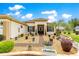 Inviting front entrance showcasing attractive landscaping and mature trees at 11871 Se 91St Cir, Summerfield, FL 34491