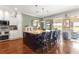Bright kitchen showcases a large island with seating and stainless steel appliances at 11871 Se 91St Cir, Summerfield, FL 34491