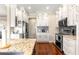 Updated kitchen features granite counters and stainless steel appliances and lots of white cabinets at 11871 Se 91St Cir, Summerfield, FL 34491