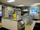 Well-equipped commercial kitchen with stainless steel appliances at 11871 Se 91St Cir, Summerfield, FL 34491