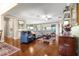 Spacious living room features hardwood floors and views into other rooms at 11871 Se 91St Cir, Summerfield, FL 34491