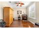 Office featuring hardwood floors, a ceiling fan, plantation shutters, and lots of space at 11871 Se 91St Cir, Summerfield, FL 34491