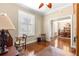 Office area, with hardwood floors, and doorway view to the formal dining room at 11871 Se 91St Cir, Summerfield, FL 34491