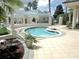 Inviting outdoor pool and spa area perfect for relaxation and leisure at 11871 Se 91St Cir, Summerfield, FL 34491