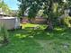 A lush, green backyard featuring mature trees at 119 Lockhart St, Daytona Beach, FL 32114