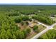Beautiful aerial view showcasing a property with lush trees and expansive green space at 12495 Sw 66Th St, Ocala, FL 34481