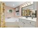 This bathroom boasts a corner soaking tub, single vanity, and decorative accents for a relaxing atmosphere at 12495 Sw 66Th St, Ocala, FL 34481