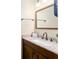 Bathroom vanity featuring a decorative countertop, bronze fixtures, and warm lighting at 12495 Sw 66Th St, Ocala, FL 34481