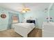 This bedroom has a nature-themed decor with a full-size bed, a built-in desk, and a large window at 12495 Sw 66Th St, Ocala, FL 34481