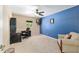 Bedroom with desk, ceiling fan, and carpeted flooring at 12495 Sw 66Th St, Ocala, FL 34481