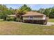 Charming single-story home with a well-manicured lawn, and side-facing garage at 12495 Sw 66Th St, Ocala, FL 34481