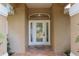 The front door of the house features a decorative glass panel and a transom window at 12495 Sw 66Th St, Ocala, FL 34481