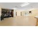 Open garage interior with office space, offering versatile use as a workshop or hobby area at 12495 Sw 66Th St, Ocala, FL 34481