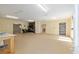 Spacious garage interior with ample room, featuring a work area, storage, and potential for various uses at 12495 Sw 66Th St, Ocala, FL 34481