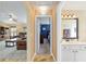 Hallway leading to a bathroom and Primary bedroom with a peek into the living room at 12495 Sw 66Th St, Ocala, FL 34481