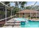 Relax in this backyard hot tub next to the pool, complete with a screened enclosure at 12495 Sw 66Th St, Ocala, FL 34481