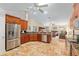Open concept kitchen with stainless appliances, granite countertops, and tile flooring at 12495 Sw 66Th St, Ocala, FL 34481