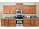 Well-equipped kitchen with stainless steel appliances and granite countertops at 12495 Sw 66Th St, Ocala, FL 34481